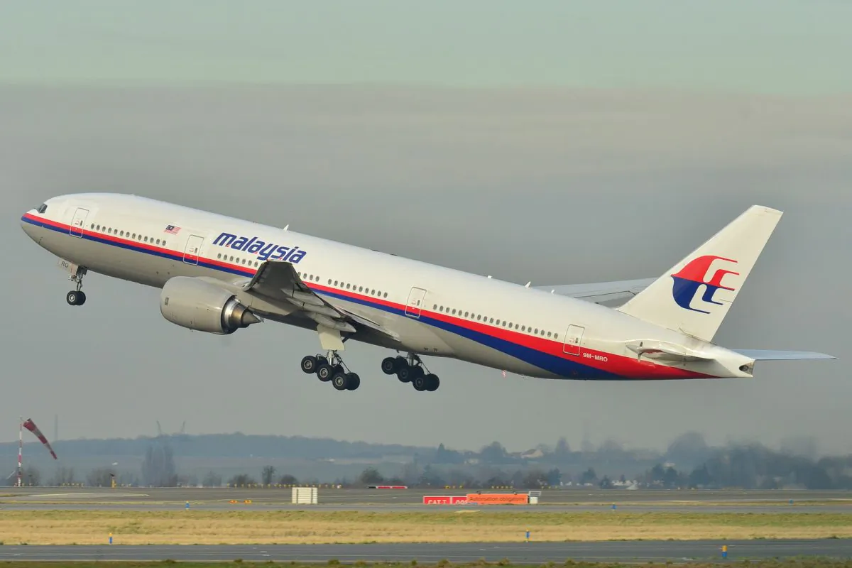 The Malaysia Airlines Boeing 777-200ER that disappeared from air traffic control screens on March 8, 2014, taking off from Roissy-Charles de Gaulle Airport in France, on Dec. 26, 2011. (Laurent Errera/AP Photo)