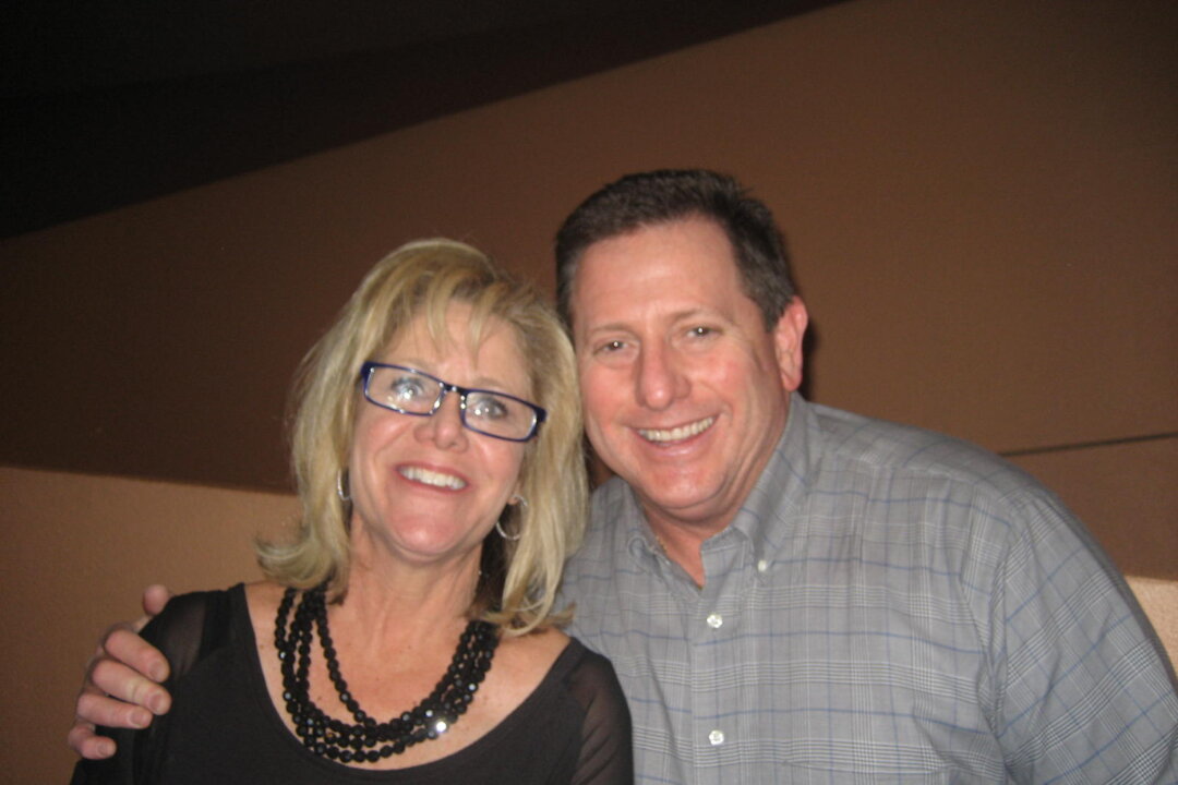 Larry Fann with his wife attending the Shen Yun Performing Arts show at the ASU Gammage Theatre in Tempe, Arizona on March 7, 2014. (Jana Li/Epoch Times)