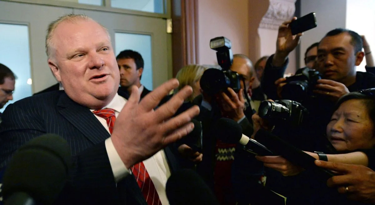 Toronto Mayor Rob Ford talks to reporters as he leaves the Big City Mayor's Meeting at Ottawa City Hall on Feb. 26, 2014. Toronto police chief Bill Blair removed himself from a lengthy criminal investigation of Rob Ford March 5. (The Canadian Press/Sean Kilpatrick)