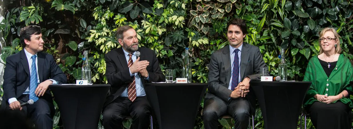 (L-R) Conservative MP Michael Chong, NDP leader Thomas Mulcair, Liberal leader Justin Trudeau, and Green Party leader Elizabeth May talk with students about democracy at an event at the University of Ottawa on March 25, 2014. (Matthew Little/Epoch Times)
