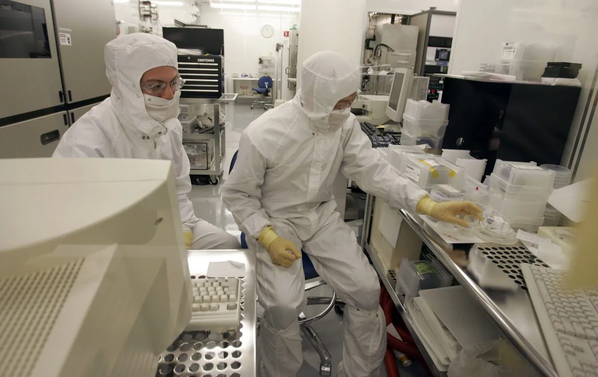 File photo shows Hewlett Packard technicians working on nanotechnology research in a clean room at HP headquarters in Palo Alto, Calif. University of Alberta researchers have developed a new sensory chip smaller than the width of a strand of hair that has the potential for use in a wide range of applications. (AP Photo/Paul Sakuma)