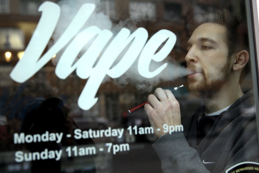 A man with an e-cigarette at Vape store in Chicago, on April 23, 2014. (Nam Y. Huh/AP Photo)