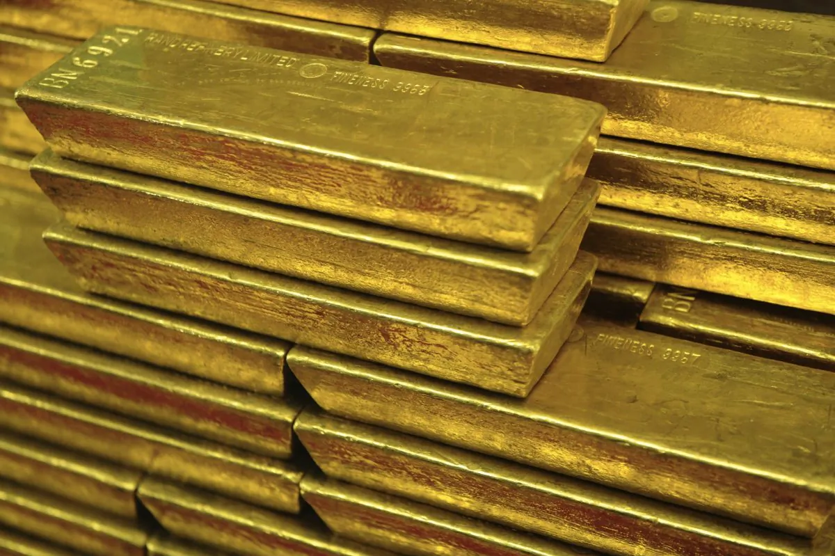 Gold bars are seen in this file photo. China’s private sector is amassing gold and has outpaced India, pushing that country to second place in 2013, according to a mid-April report by the World Gold Council (WGC). (MICHAL CIZEK/AFP/Getty Images)