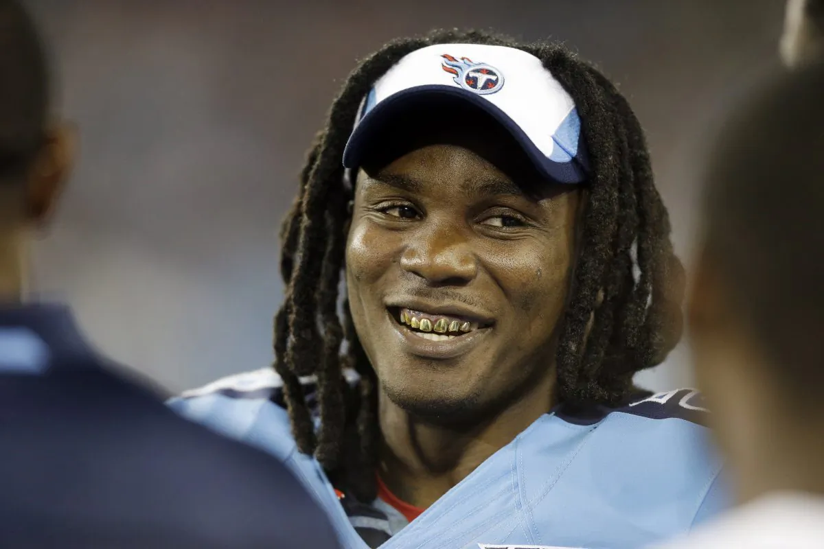 Then-Tennessee Titans running back Chris Johnson talks with teammates on the sideline in the third quarter of a preseason NFL football game against the Washington Redskins, in Nashville, Tenn., on Aug. 8, 2013. (Wade Payne/AP Photo)