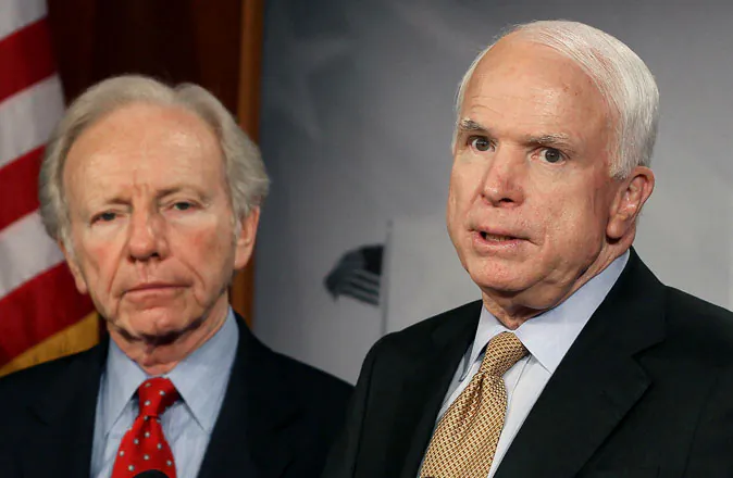 U.S. Sen. John McCain (R-AZ) (R) and U.S. Sen. Joseph Lieberman (I-CT) on Capitol Hill on March 28, 2012 in Washington, DC. (Mark Wilson/Getty Images)