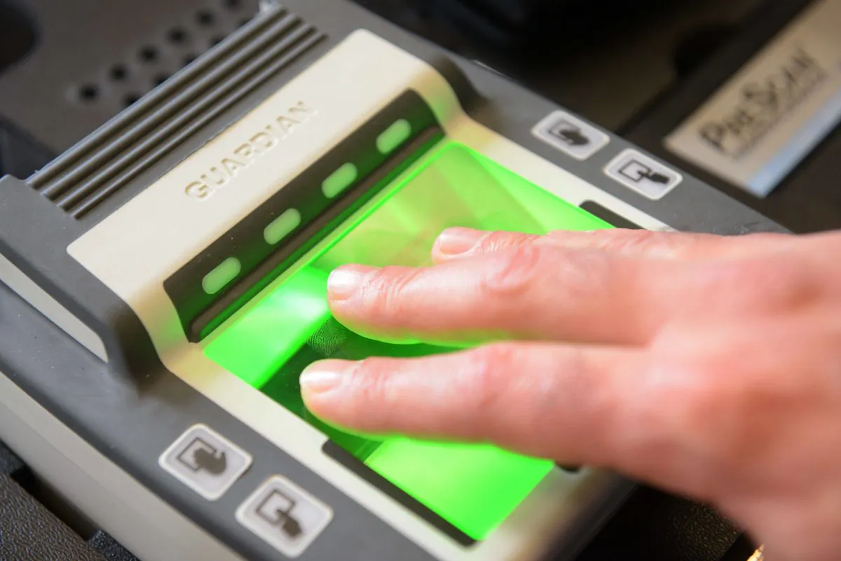 A fingerprint reader collects biometric data for a mobile passport-making machine at the French embassy in Beijing on Sept. 8, 2012. (Ed Jones/AFP/GettyImages)