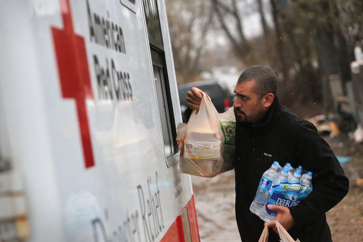 Robert Munoz collects supplies from a mobile Red Cross unit on November 7, 2012 in the Staten Island borough of New York City. He and fellow residents of the seaside Midland Beach area of Staten Island prepared for a Nor'Easter storm that could potentially re-flood areas devastated by Superstorm Sandy. (John Moore/Getty Images)