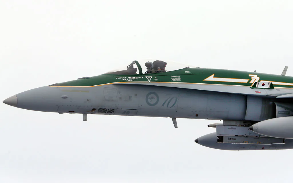 A Royal Australian Air Force F/A-18 Hornet flys next to a KC-30A Multi Role Tanker Transport aircraft fuel line during the Australian Defence Force Air-To-Air refuelling on February 27, 2013 in Melbourne, Australia. The Australian Federal Government is planning to replace the ageing F/A-18 and already retired F-111 bomber with a fleet of 100 F-35 Lightning ll, at a cost of AUD$16 billion, with the first of the jets to be delivered to the Royal Australian Air Force at the end of 2014. (Michael Dodge/Getty Images)