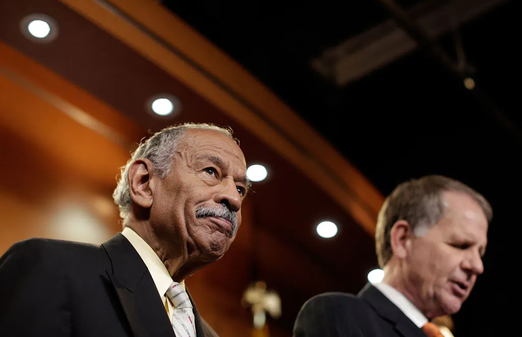 Rep. John Conyers (D-MI) (L) and Rep. Ted Poe (R-TX) (R) hold a news conference on H.R.1962, the 'Free Flow of Information Act of 2013', May 22, 2013 in Washington, DC. The bill would protect reporters from having to reveal their sources in federal court, with some exceptions including specific threats to national security. (Win McNamee/Getty Images)