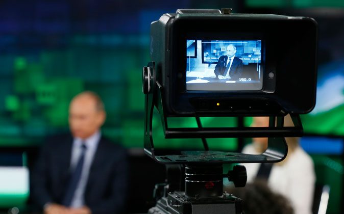 Russia's President Vladimir Putin visits the new studio complex of the state-owned English-language Russia Today television network in Moscow, on June 11, 2013. (Yuri Kochetkov/AFP/Getty Images)