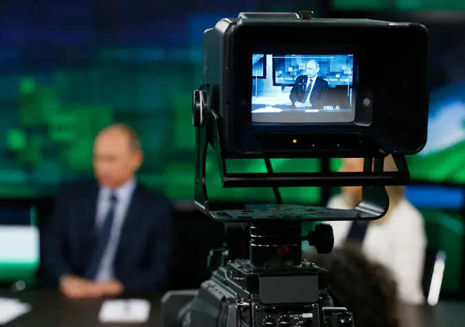 Russia's President Vladimir Putin visits the new studio complex of the state-owned English-language Russia Today television network in Moscow, on June 11, 2013. (Yuri Kochetkov/AFP/Getty Images)