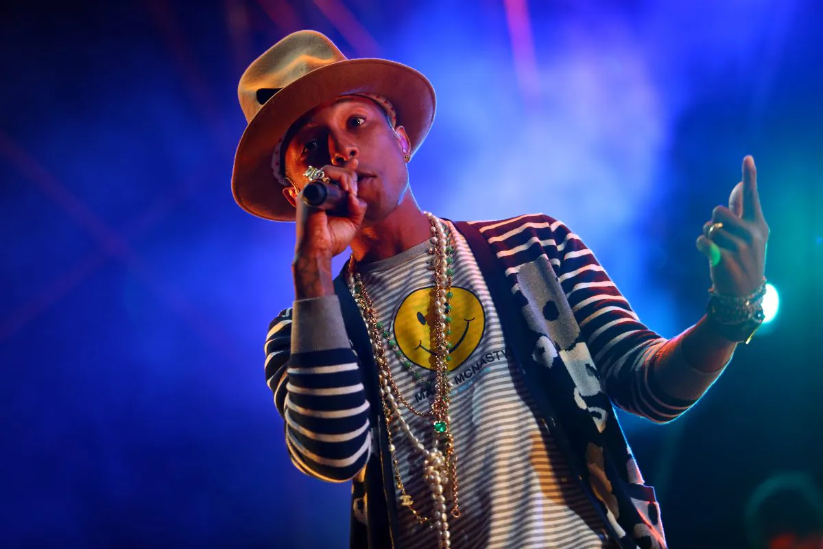 FILE - This April 19, 2014 file photo shows Pharrell Williams performing at the 2014 Coachella Music and Arts Festival in Indio, Calif. Pharrell, Drake and Blake Shelton are among the A-Listers set to perform at the first ever iHeartRadio Music Awards. Clear Channel announced Monday, April 21, that Kendrick Lamar, Shakira, Ed Sheeran and Arcade Fire will also take the stage at the May 1 awards show in Los Angeles. (Photo by Zach Cordner/Invision/AP)