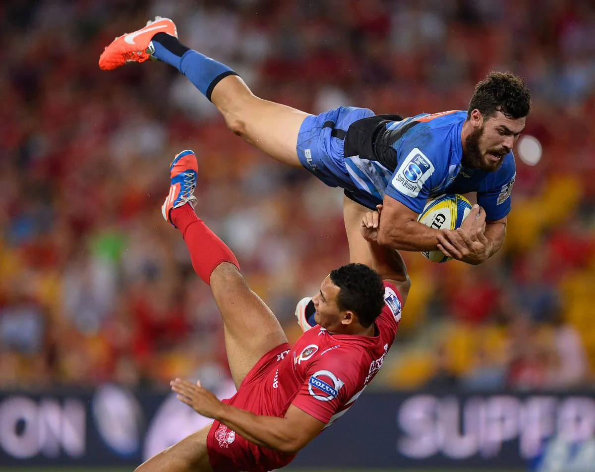 Force fullback Jayden Hayward out-jumps young Reds fullback Jonah Placid to take a high ball on Saturday April 5, 2014. (Ian Hitchcock/Getty Images)