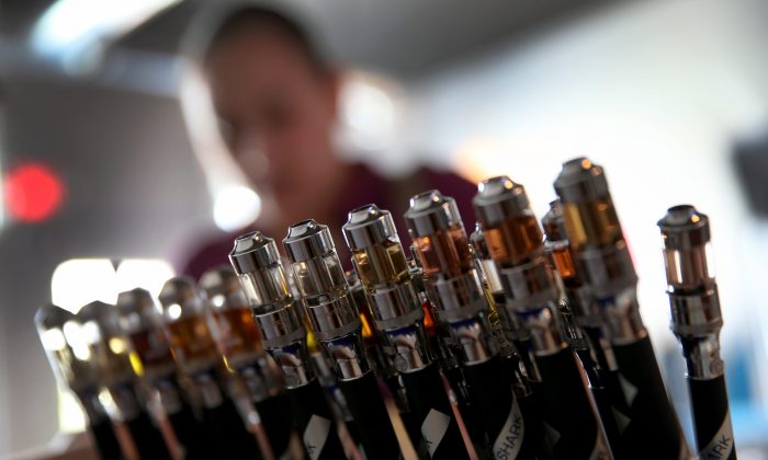 Electronic cigarettes with different flavored E-liquid are seen on display at the Vapor Shark store on February 20, 2014 in Miami, Florida. (Joe Raedle/Getty Images)
