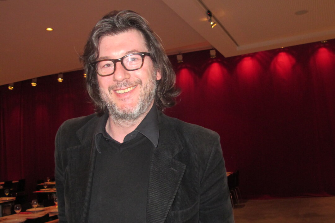 Graphic Artist Gilluame Pinet at Shen Yun Performing Arts production at the National Theatre, Brussels. [Mary Mann/Epoch Times] 