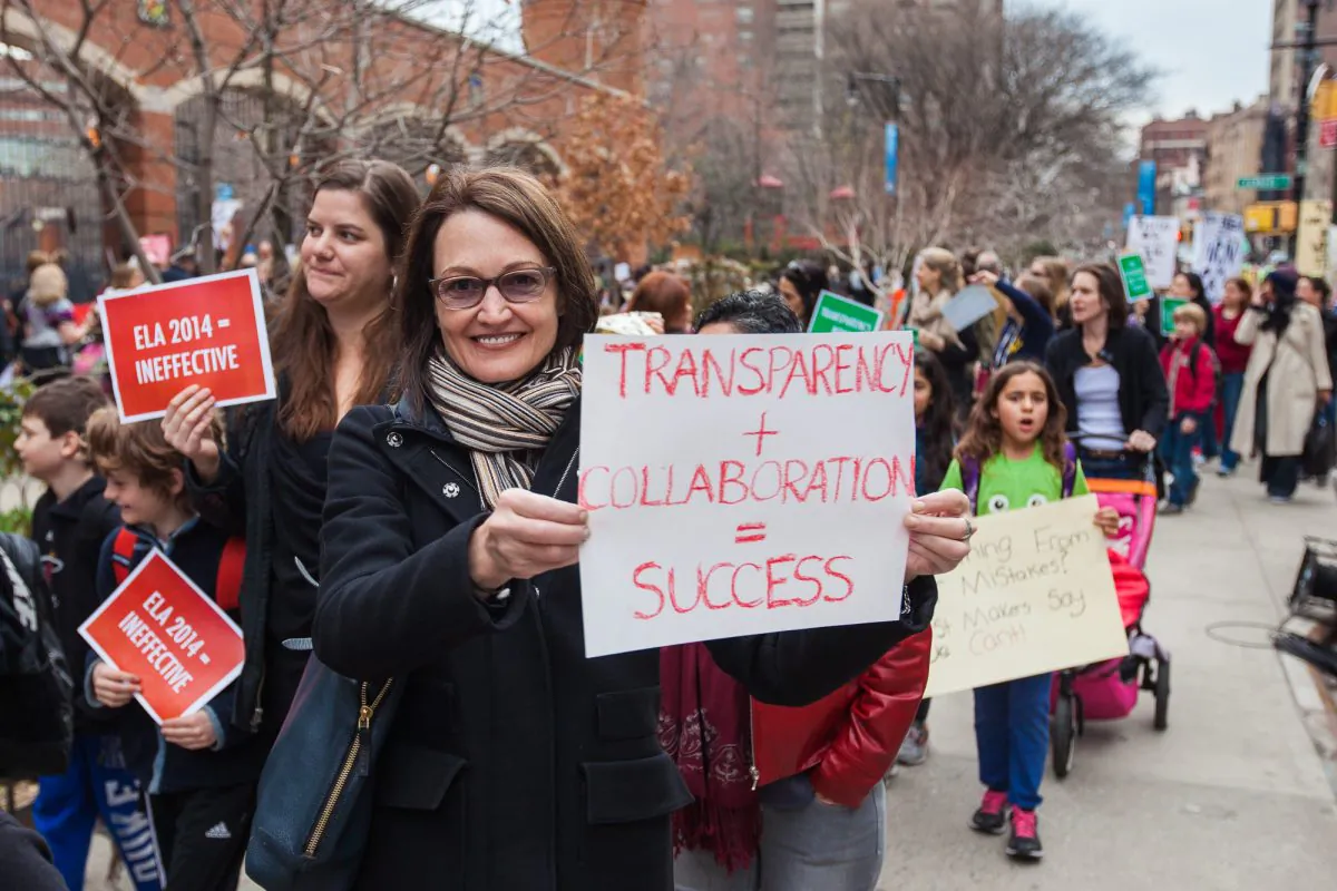 Parents and students walk to protest the quality of the state English test in front of P.S. 234 in Tribeca, Manhattan, New York, on April 11, 2014. (Petr Svab/Epoch Times)