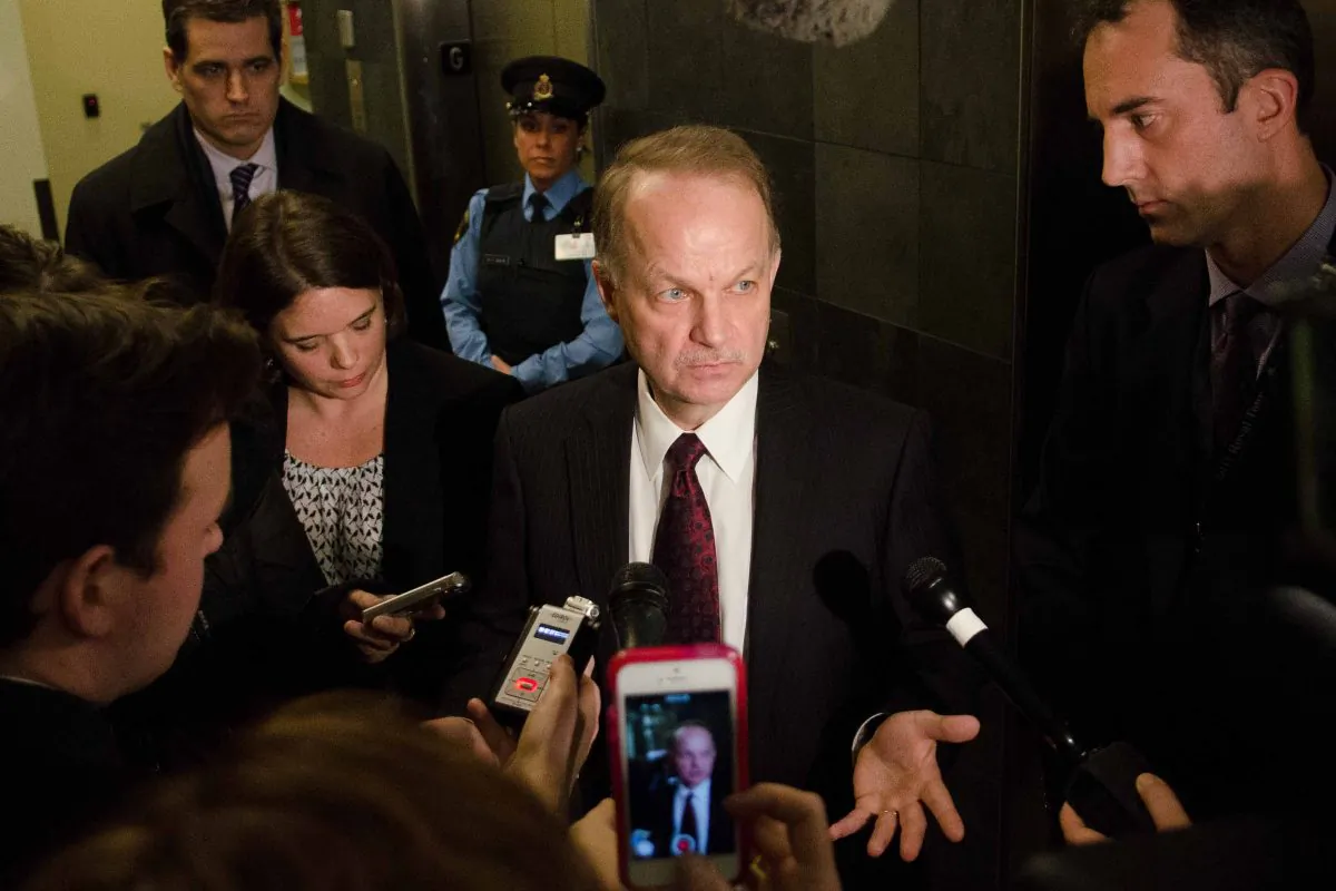 CSEC chief John Forster speaks to reporters after he defended his agency's collection of metadata from Canadians during a Senate committee hearing on Monday, Feb. 3, 2014. (Matthew Little/Epoch Times)