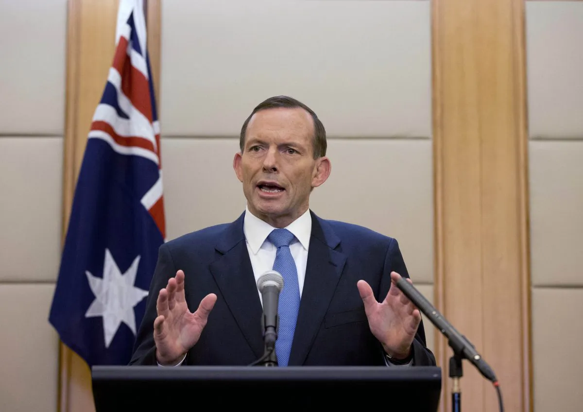 Former Australian Prime Minister Tony Abbott speaks during a press conference at a hotel in Beijing, China, on April 12, 2014. (AP Photo/Andy Wong)