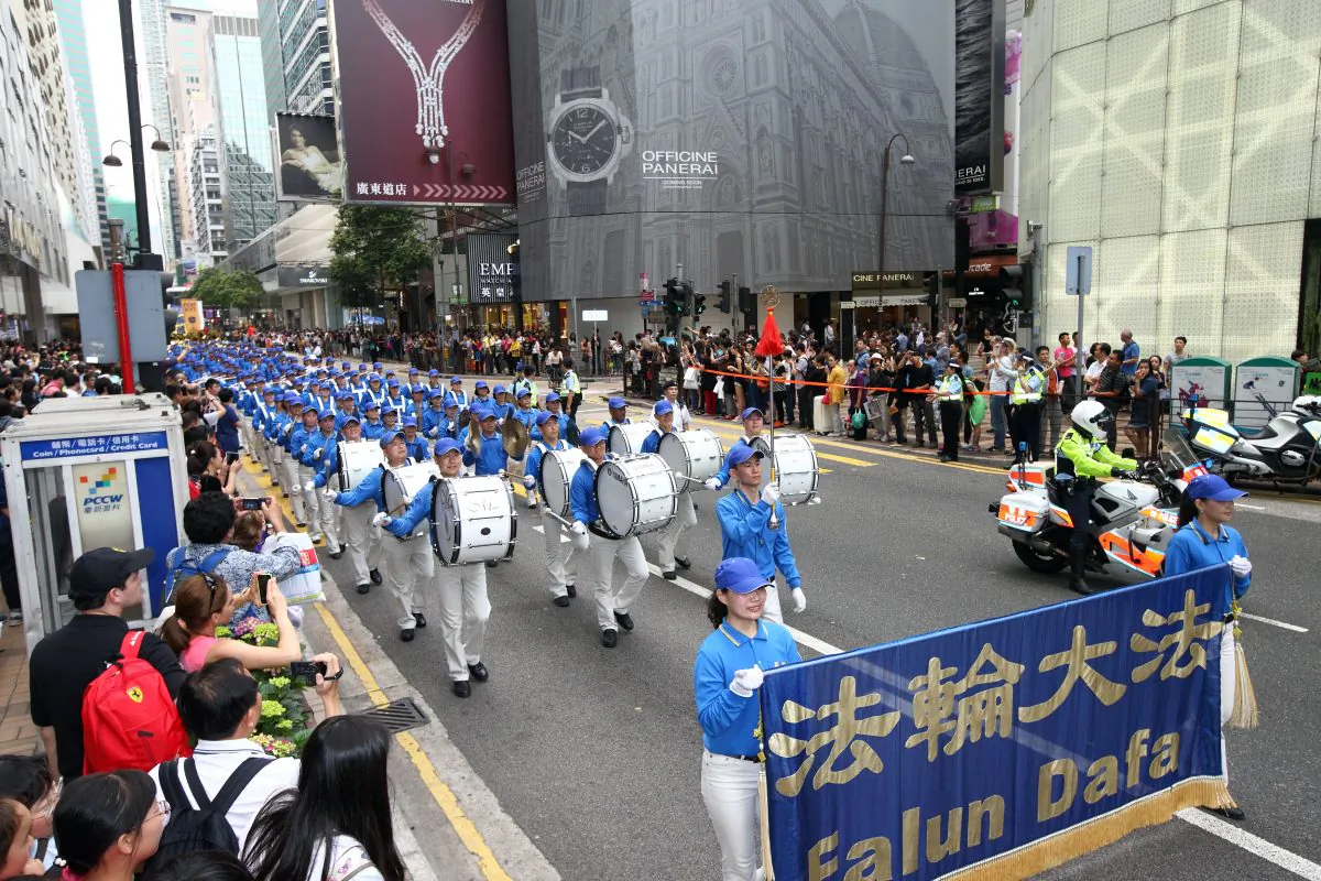  The Falun Dafa TianGuo marching band performs in the April 20 parade commemorating the April 25 Peaceful Appeal. (Epoch Times)