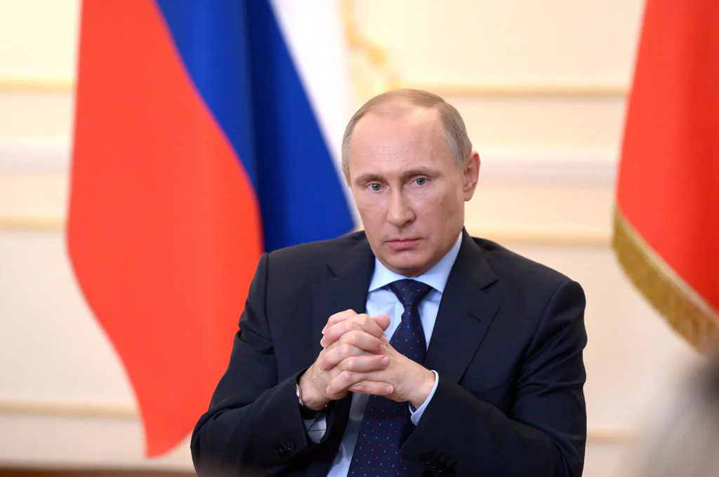 Russian President Vladimir Putin looks on during a press conference in his country residence of Novo-Ogaryova outside Moscow on March 4, 2014. Russian President Vladimir Putin on March 4 said that deposed Ukrainian president Viktor Yanukovych had no political future but asserted he was legally still head of state. (Alexey Nikolsky/AFP/Getty Images)