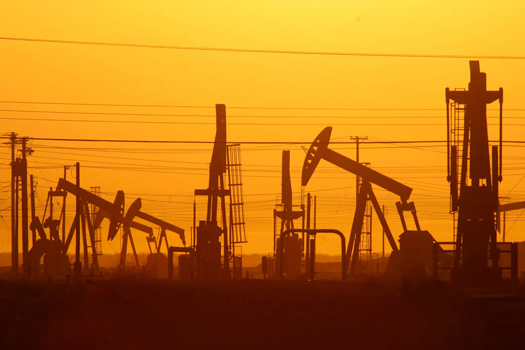 Pump jacks are seen at dawn in an oil field over the Monterey Shale formation where gas and oil extraction using hydraulic fracturing, or fracking, on March 24, 2014 near Lost Hills, California.  Recently, Ohio legislators have linked fracking to seismic activity, (David McNew/Getty Images)