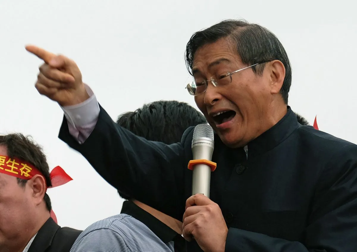 Chang An-lo, a pro-China activist also known as the 'White Wolf', gestures as he speaks during a demonstration to support the government and a controversial Taiwan-China trade pact in Taipei on April 1, 2014. (Sam Yeh/AFP/Getty Images)