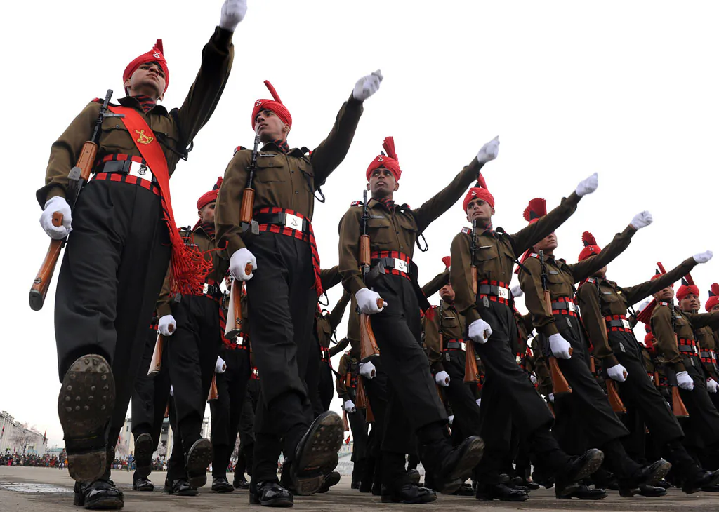 New recruits of the Jammu and Kashmir Light Infantry Regiment (JKLIR) march during a parade at an Indian Army base on outskirts of Srinagar on April 5, 2014. (Rouf Bhat/AFP/Getty Images)