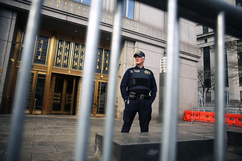 A security officer stands outside of U.S. Federal Court House on the morning the court begins jury selection for the Abu Hamza terrorism trial on April 14, 2014 in New York City. Hamza, a disabled Egyptian Islamic preacher who was extradited from Britain following charges he conspired to support al-Qaida, is being charged for trying to create a terrorist training camp in Oregon 15 years ago. (Spencer Platt/Getty Images)