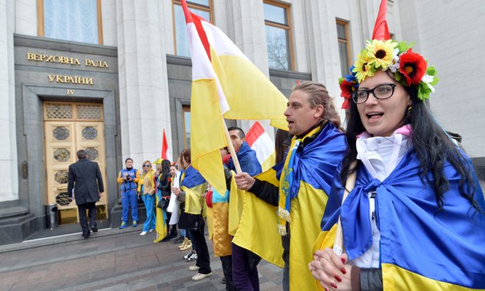 Protesters rally outside the Ukrainian Parliament in Kiev on April 15, 2014, during a session as they demand from the authorities actions against separatism on the eastern part of the country. Russian Foreign Minister Sergei Lavrov on Tuesday warned Kiev against using force to quell pro-Moscow separatists in eastern Ukraine, saying the 'criminal' act would undermine talks planned in Geneva. (Sergei Supinsky/AFP/Getty Images)