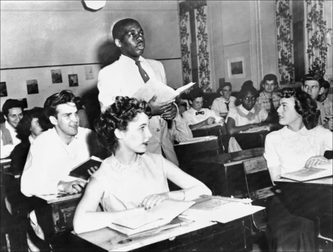 A black student, Nathaniel Steward, 17, recites his lesson May 21, 1954, at the Saint-Dominique school, in Washington, where for the first time in USA the Brown v Board of Education decision which outlaws segregation in state schools is applied. In Tuscaloosa, Ala., today, nearly one in three black students attends a school that looks as if Brown v. Board of Education never happened. (Staff/AFP/Getty Images)