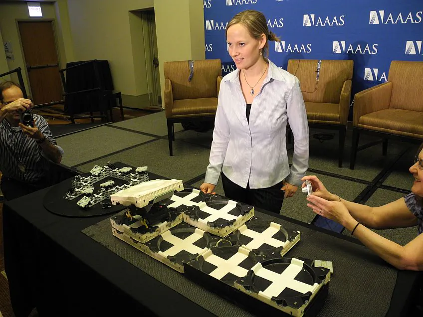 Kirstin Petersen, an academic fellow in artifical intelligence at Harvard University, demonstrates robots inspired by termites at the American Association for the Advancement of Science meeting in Chicago, on Feb. 13, 2014. (Kerry Sheridan/AFP/Getty Images)