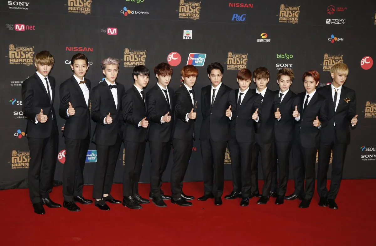 South Korean music band EXO poses poses for photographers on the red carpet of the South Korean Mnet Asian Music Awards (MAMA) in Hong Kong Friday, Nov. 22, 2013. (AP Photo/Kin Cheung)