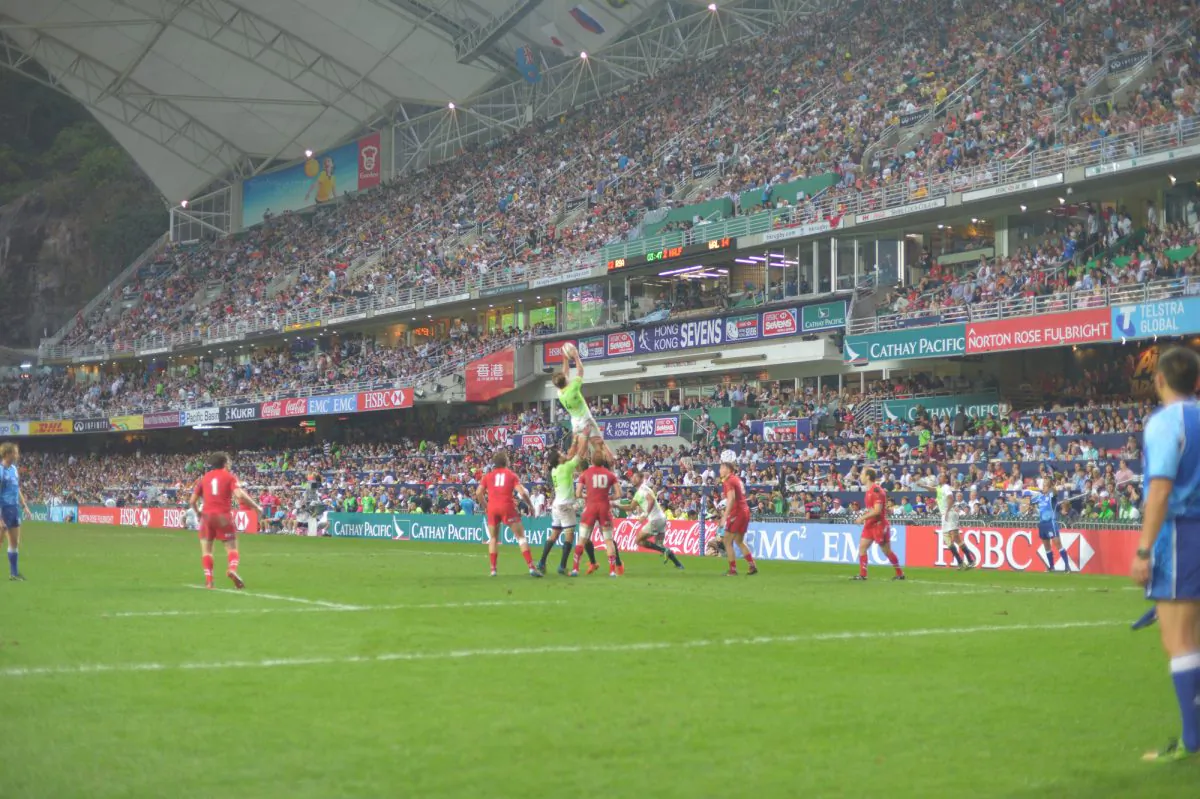Sold out ... The 40,000 seat Hong Kong Stadium bulged at the seams as the final matches were played at the Cathay Pacific/HSBC Hong Kong Sevens on Sunday Mar 30, 2014. South Africa’s Kwagga Smith won this line-out against Wales in the Plate Final. His team won 19-14. (Bill Cox/Epoch Times)