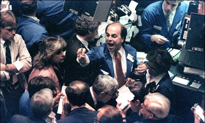 This photo from Oct. 19, 1987, shows a trader on the New York Stock Exchange shouting orders as stocks recorded the worst one-day decline in history. While a repeat of the historic crash in unlikely, markets today are vulnerable to a correction. (MARIA BASTONE/AFP/Getty Images)