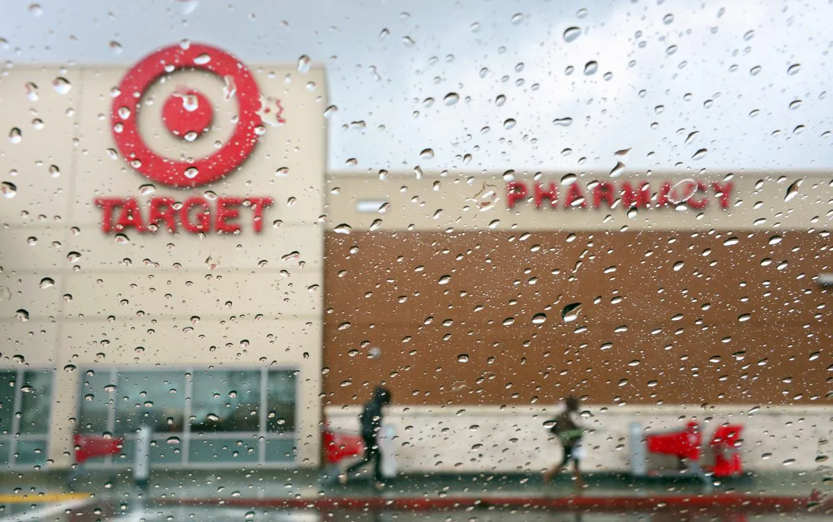 Shoppers leave a Target store on a rainy afternoon in Alhambra, Calif., Dec. 19, 2013. (FREDERIC J. BROWN/AFP/Getty Images)