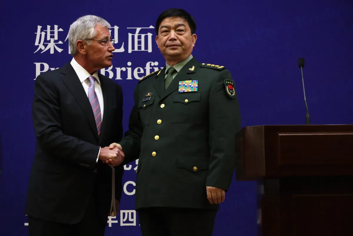 U.S. Secretary of Defense Chuck Hagel (L) and Chinese Minister of Defense Chang Wanquan (R) shake hands on April 8 in Beijing, China. The United States is asking China for more transparency on cybersecurity. (Alex Wong/Getty Images)