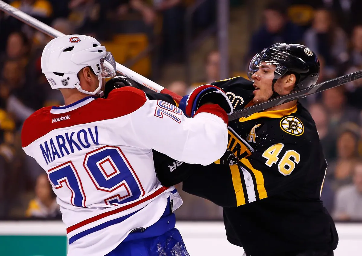 David Krejci of the Boston Bruins shoves Andrei Markov of the Montreal Canadiens at TD Garden on March 24 in Boston. (Jared Wickerham/Getty Images)