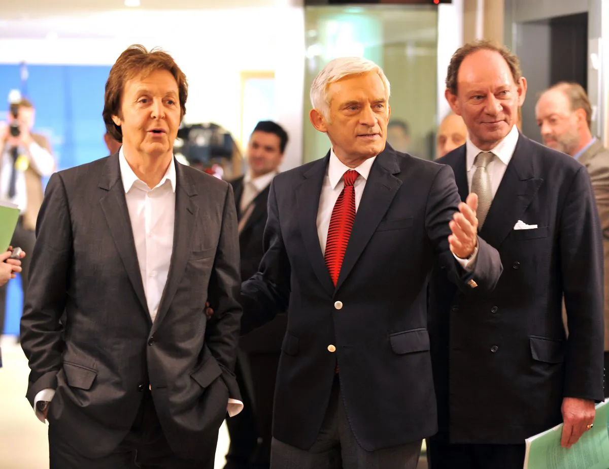 European Parliament Vice President Edward McMillan-Scott (R) and European Parliament President Jerzy Buzek (C) welcome British pop star Paul McCartney at the European Parliament in Brussels on Dec. 3, 2009. (Georges Gobet/AFP/Getty Images)