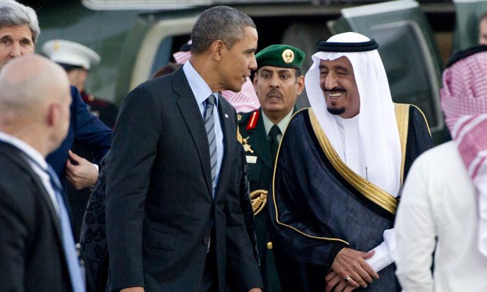 U.S. President Barack Obama (C-L) is greeted by Saudi Crown Prince Salman bin Abdulaziz al-Saud (C-R) upon his arrival, ahead of a meeting with Saudi King Abdullah, on March 28, 2014. (Saul Loeb/AFP/Getty Images)