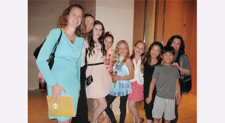 Five girls and one boy studying dancing and four moms were in awe of the dancers in Shen Yun Performing Arts, at the Overture Center for the Arts, on April 10. (Cat Rooney/Epoch Times) 