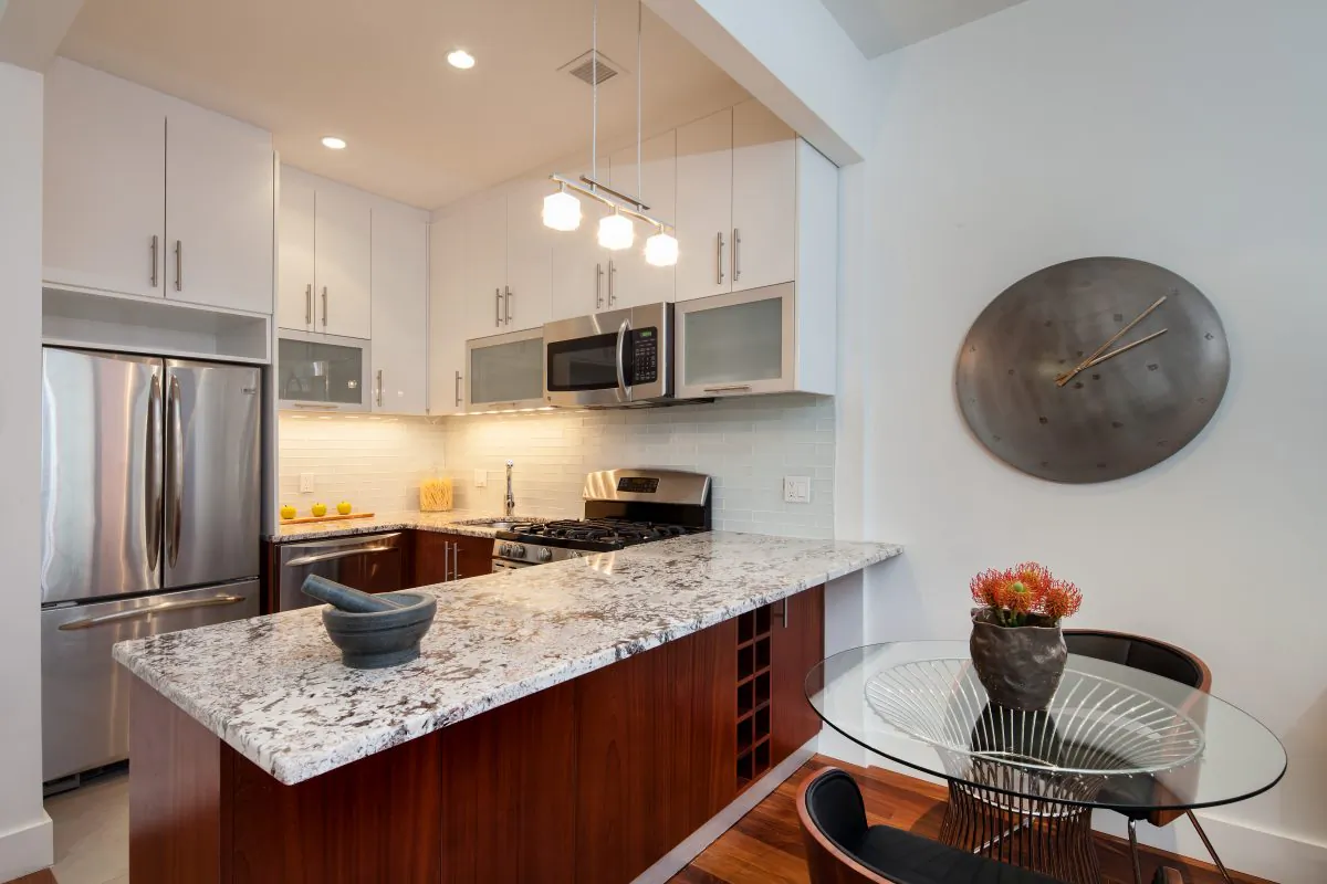 The kitchen of a Millstone condo in Long Island City. (courtesy of aptsandlofts.com)