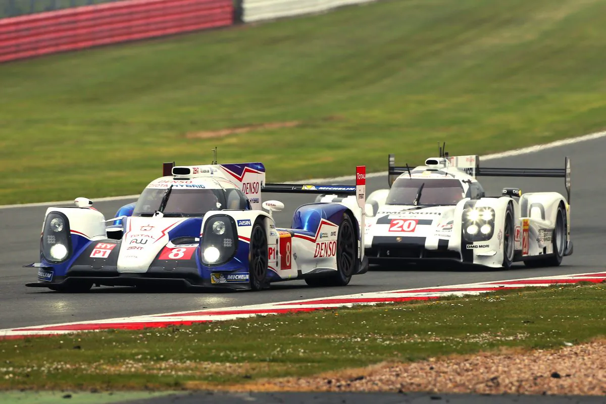 The #8 Toyota TS040 Hybrid leads the #20 Porsche 919 Hybrid during the WEC Six Hours of Silverstone, April 20, 2014. (toyotahybridracing.com)