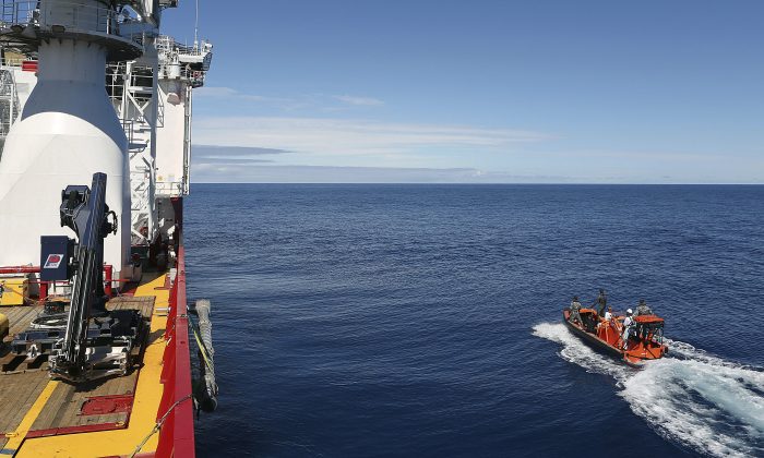 In this April 7, 2014 photo provided by the Australian Defense Force a fast response craft manned by members ofthe Australian Defense's ship Ocean Shield is deployed to scan the water for debris of the missing Malaysia Airlines Flight 370 in the southern Indian Ocean. Up to 14 planes and as many ships were focusing on a single search area covering 77, 580 square kilometers (29,954 square miles) of ocean, 2,270 kilometers (1,400 miles) northwest of the Australian west coast city of Perth, Australia. (AP Photo/Australian Defense Force, LSIS Bradley Darvill) EDITORIAL USE ONLY