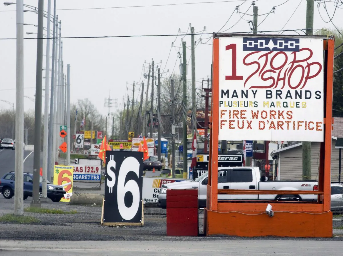 Cigarette shacks line "Tobacco Road" on the Mohawk reserve in Kahnawake, Que., 2008. Police in Quebec say they have arrested 28 people in a crackdown on tobacco trafficking that allegedly involved the Italian Mafia and native organized crime. (The Canadian Press/Ryan Remiorz)
