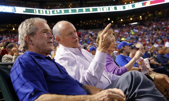 Former Texas Rangers president Nolan Ryan, right, shared the front row with former President George W. Bush as Ryan made his return, with his new team the Houston Astros, at the Globe Life Park in Arlington, TX on Friday, April 11, 2014.(AP Photo/The Dallas Morning News, Tom Fox)