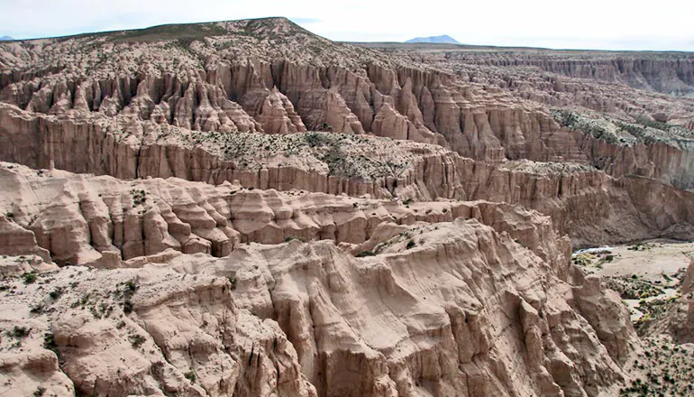 Sedimentary deposits near Cerdas in the Altiplano plateau of Bolivia. These rocks contain ancient soils used to decipher the surface temperature and surface uplift history of the southern Altiplano. (Carmala Garzione/University of Rochester)