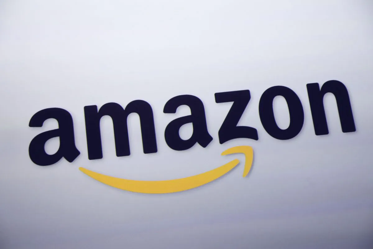 FILE - This Sept. 28, 2011 file photo shows the Amazon logo on display at a news conference in New York. (AP Photo/Mark Lennihan, File)