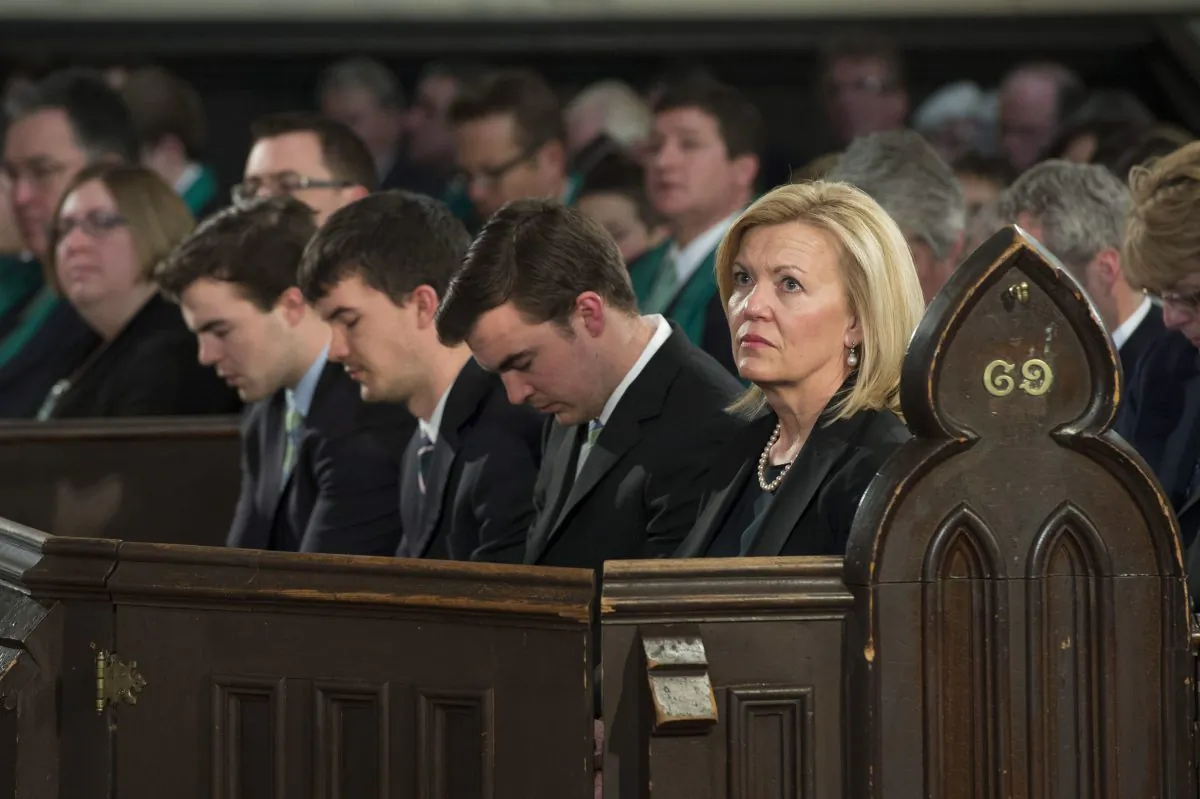 Christine Elliott and her sons Quinn, John, and Galen wait for the start of the state funeral for her late husband Jim Flaherty in Toronto on Wednesday, April 16, 2014. (The Canadian Press/Frank Gunn)