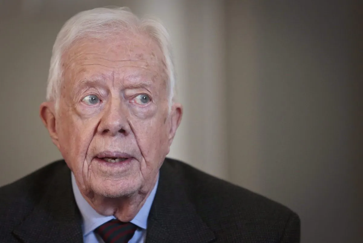 Former U.S. president Jimmy Carter speaks during an interview on March 24, 2014, in New York. The Prime Minister's Office reacted swiftly to a letter signed by Nobel laureates, including Carter, urging President Barack Obama to reject the Keystone XL pipeline. (AP Photo/Bebeto Matthews)