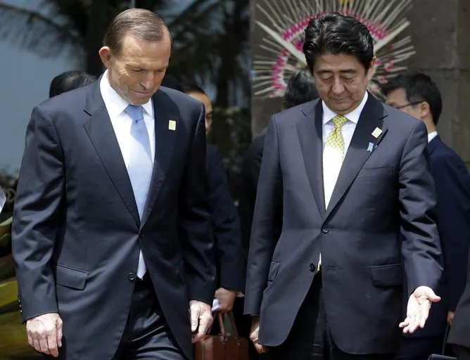 Tony Abbott has declared Japan, under prime minister Shinzo Abe, as Australia’s ‘best friend in Asia’. But this might come at a cost as Abbott seeks to close a FTA with China. (EPA/Mast Irham)